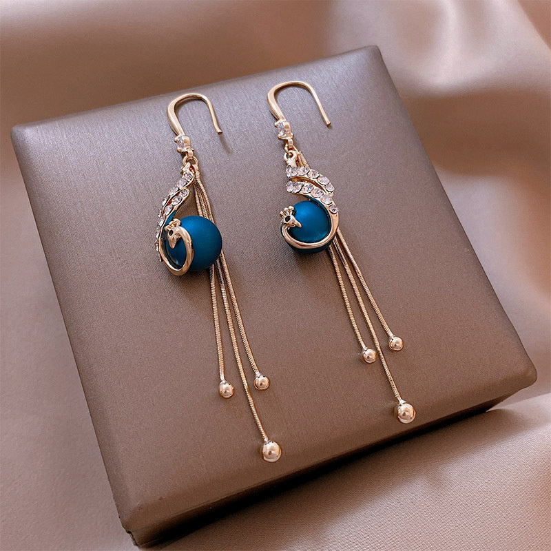 Boucles d'oreilles en perles bleues inspirées du paon